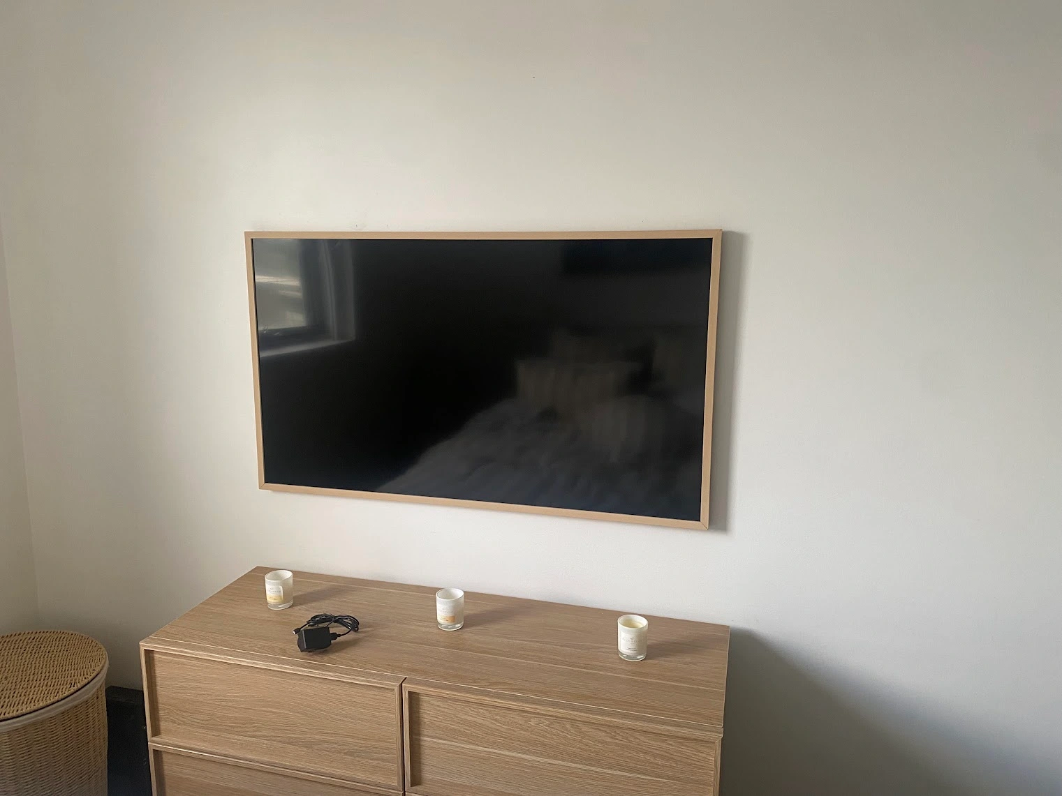LG Gallery TV mounted flush in a bedroom